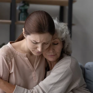 Family members comforting each other after the loss of a loved one